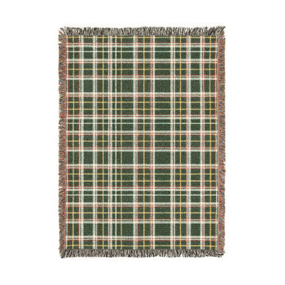A rectangular woven throw blanket with a green, white, and yellow plaid pattern and fringed edges, shown flat against a white background.