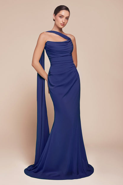 Woman wearing a blue one-shoulder evening gown on a beige background