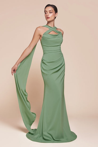 Woman wearing a green evening gown on a beige background