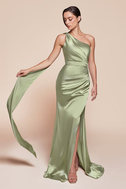 Woman wearing a green one-shoulder evening gown on a beige background