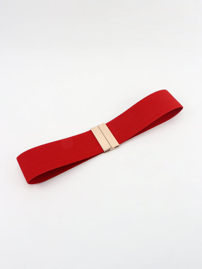 Red belt with a gold buckle on a white background