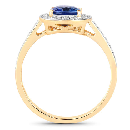 Genuine blue sapphire and white diamond ring in 18K yellow gold, featuring a 1.31 carat sapphire and intricate band design.