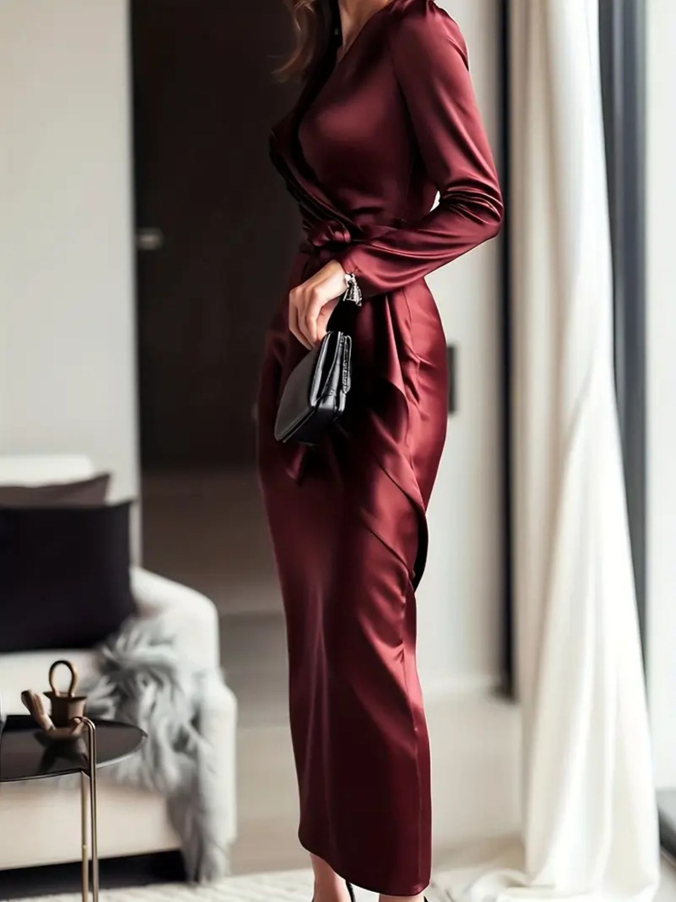 Side Angle: Long sleeve satin midi dress side profile displaying draped fabric movement and tie waist silhouette