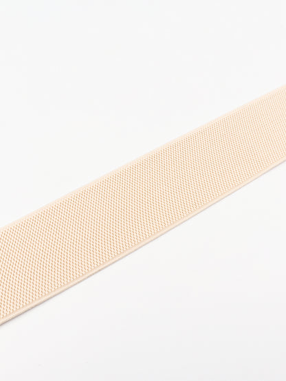 Beige woven belt on a white background