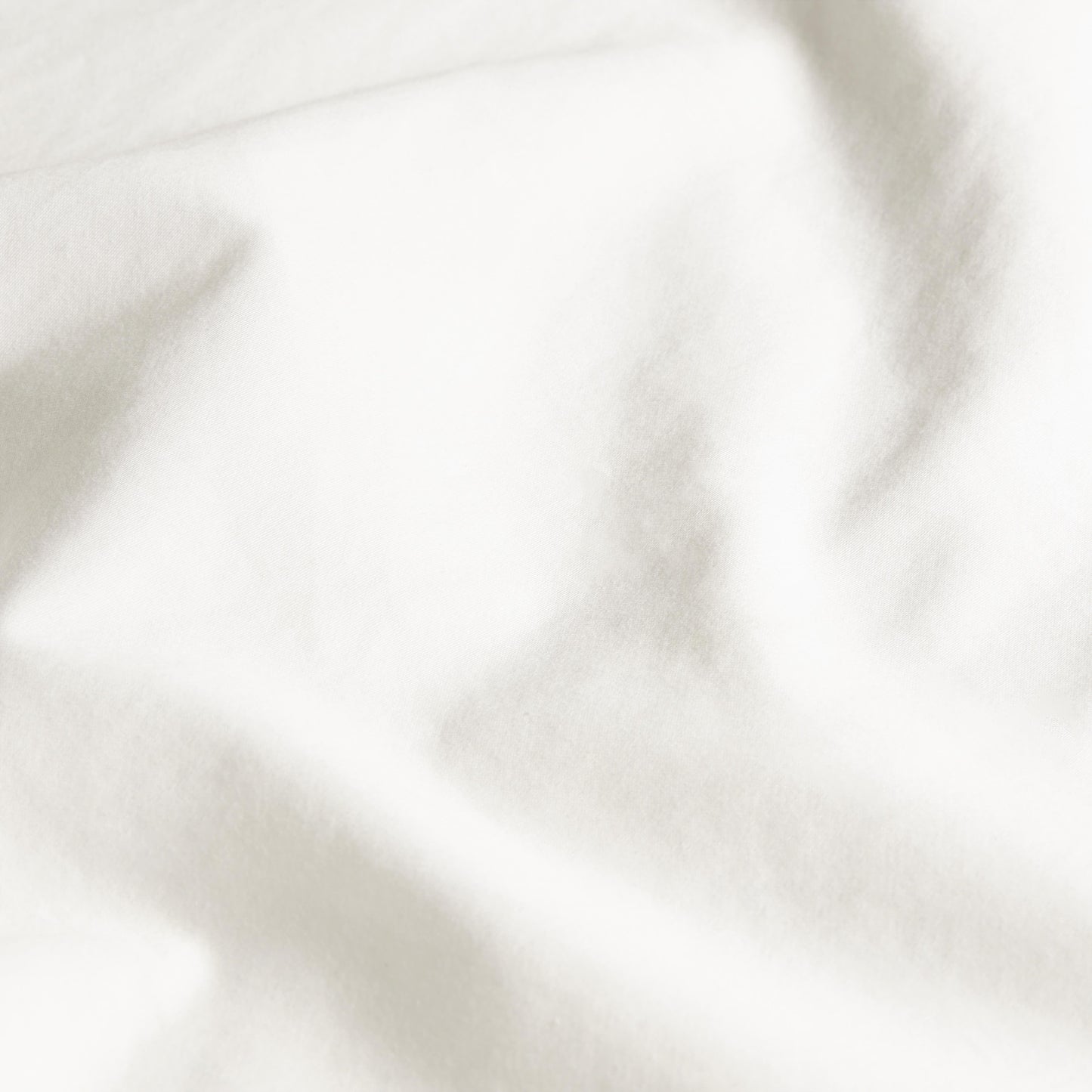 Close-up of white fabric with folds