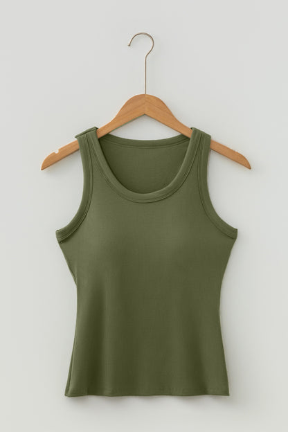 Green tank top on a wooden hanger against a white background