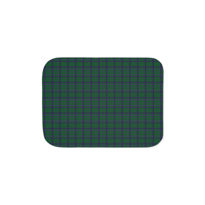 A rectangular mat with rounded corners, featuring a dark green and black plaid pattern, shown against a plain white background.