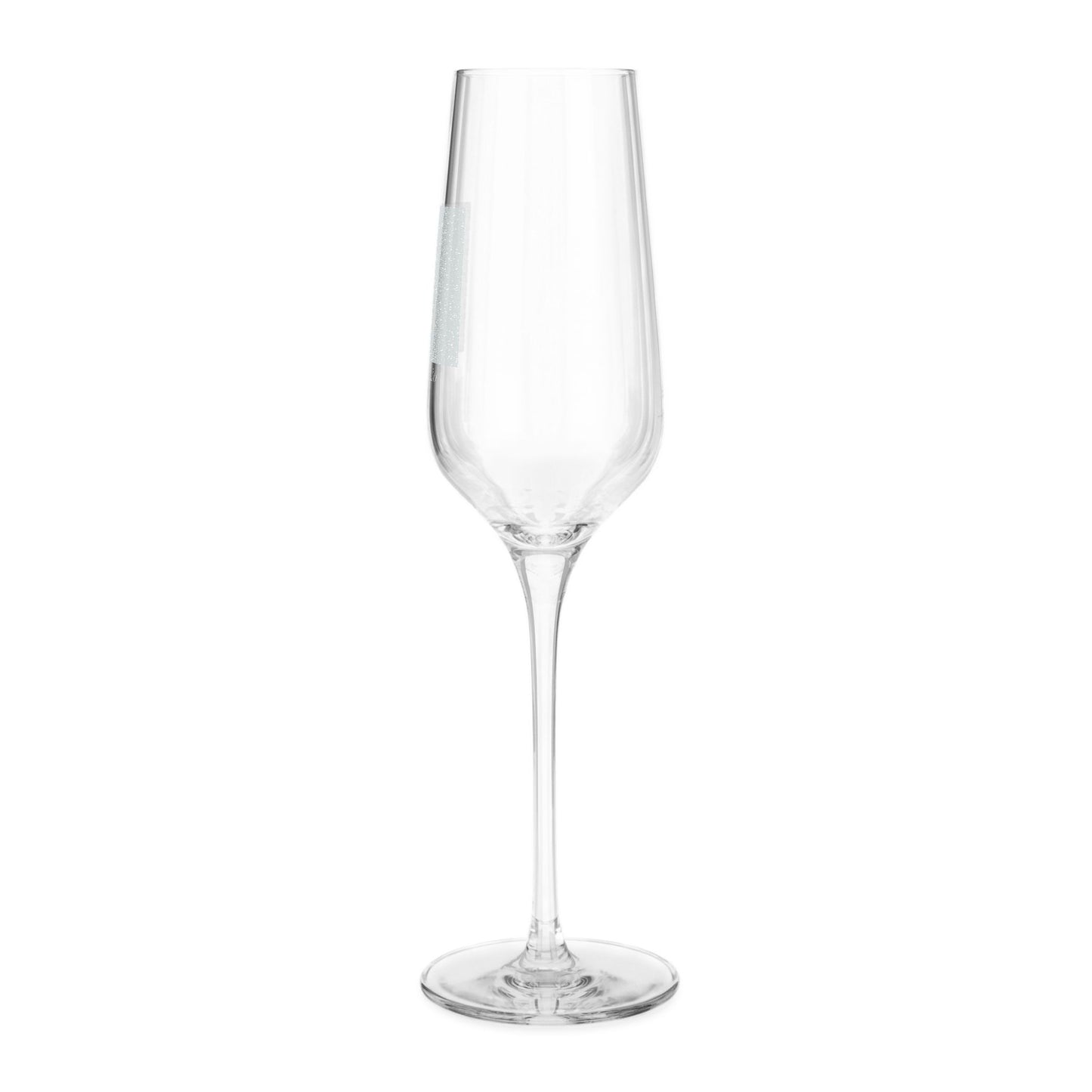 A single clear glass champagne flute with a long stem and a small white label on the side, isolated on a white background.