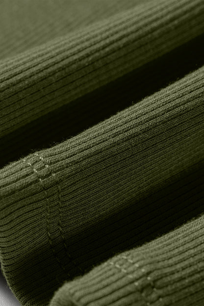 Close-up of green ribbed fabric with a textured pattern