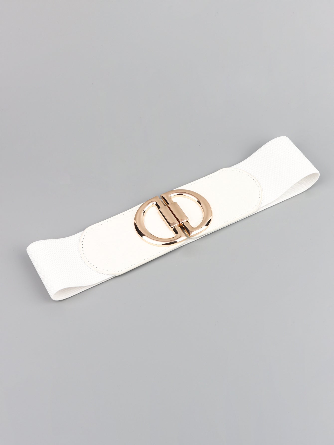 White belt with a gold buckle on a gray background