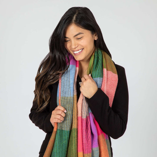 Woman wearing a colorful scarf on a white background