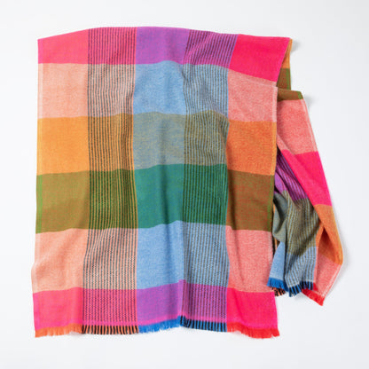 Colorful plaid blanket with a mix of pink, purple, orange, green, and blue on a white background.