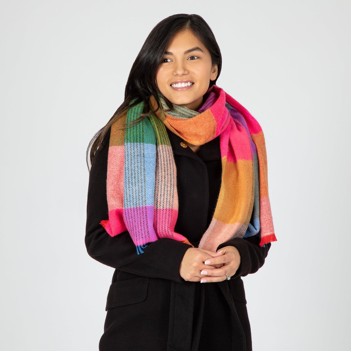 Colorful plaid scarf in bright pink, blue, green orange, cream.