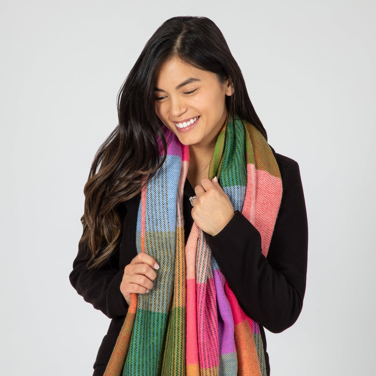 Woman wearing a colorful scarf on a white background