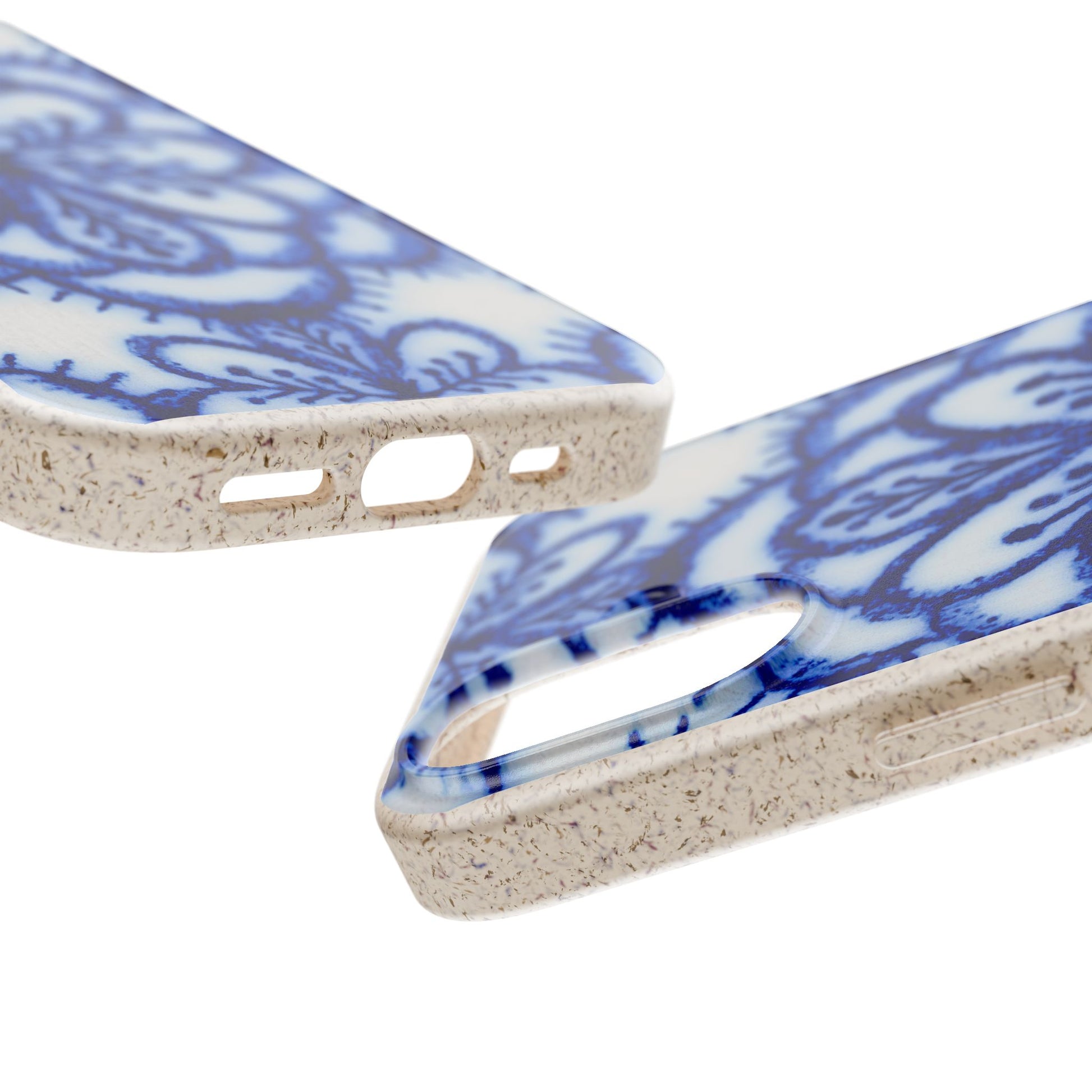 Two close-up views of a smartphone case with a blue floral pattern on a white base and a speckled beige edge, shown on a plain white background.