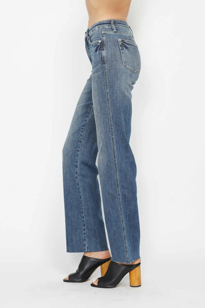 Women's Judy Blue tummy control straight leg jeans in medium wash, front view on model showcasing smoothing waistband and flattering fit, boutique denim product photography