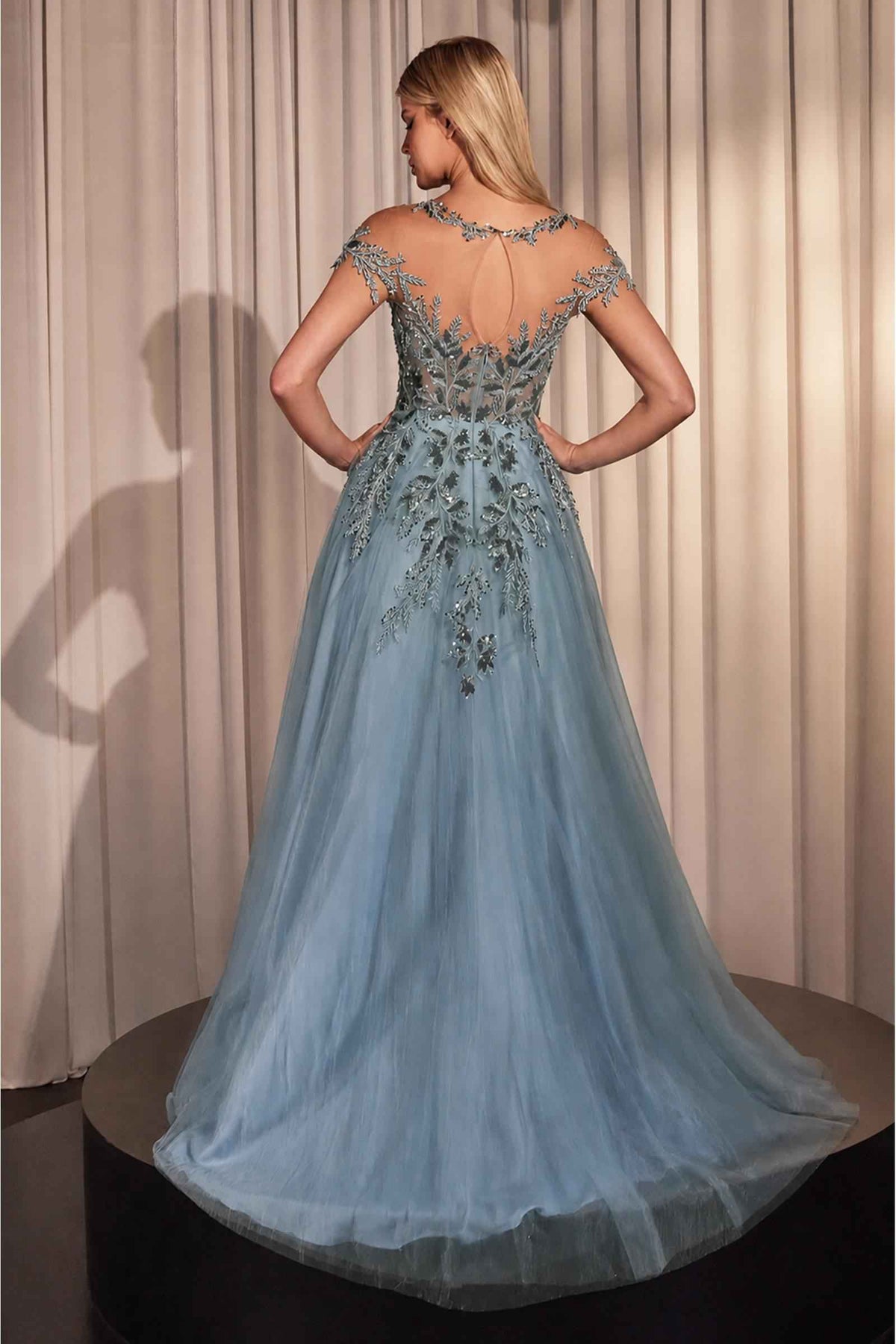 Back view of Andrea & Leo A1475 dusty blue gown with sheer illusion back, floral appliqué and tulle train.