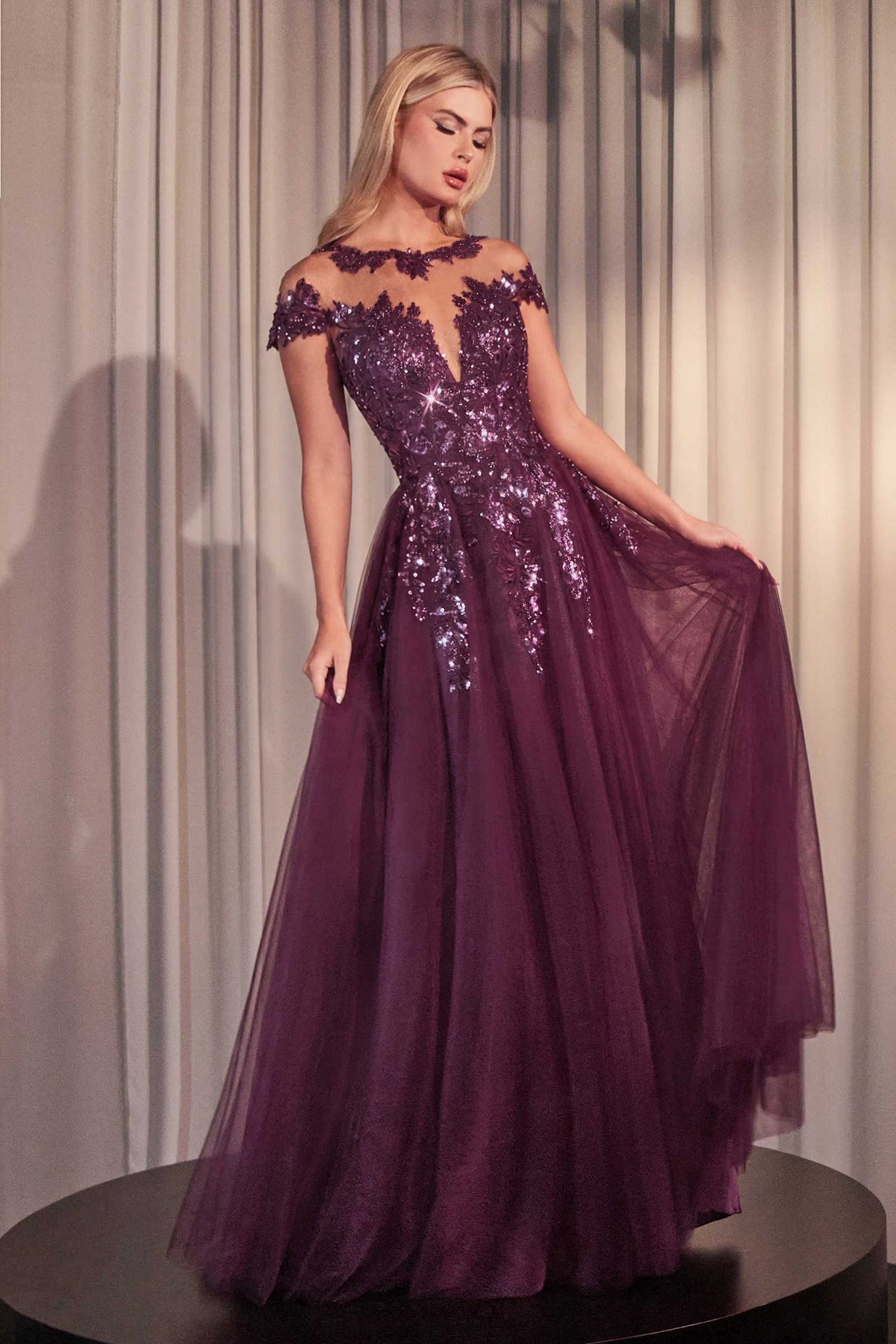 Andrea & Leo A1475 eggplant gown with shimmering floral embellishments, cap sleeves and a flowing tulle skirt.