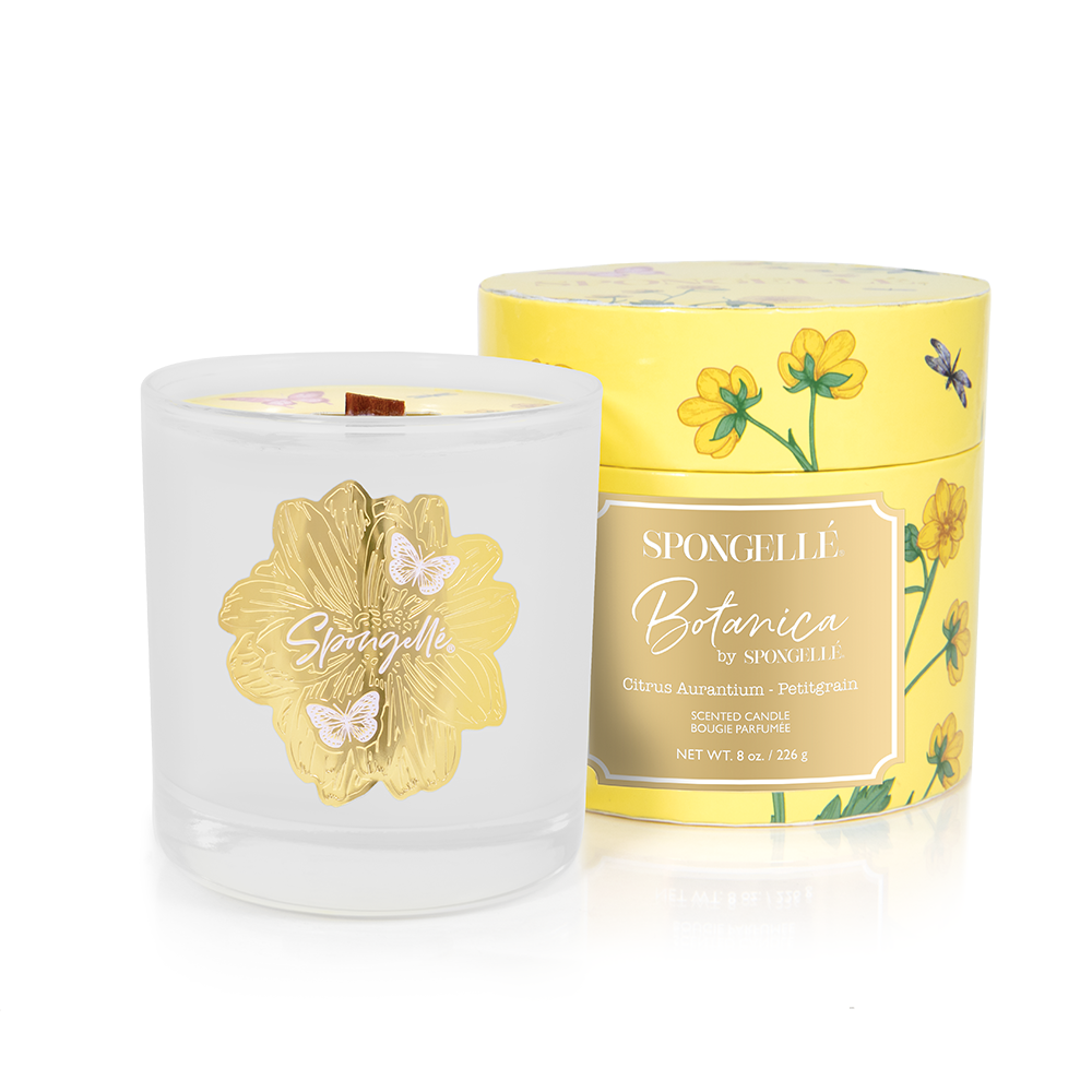 Spongellé Botanica Petitgrain candle in a clear glass jar with a gold floral design and yellow floral box packaging.