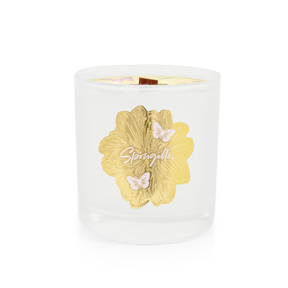 White glass candle with a gold floral design and butterflies, labeled "Petitgrain | Botanica Candle.