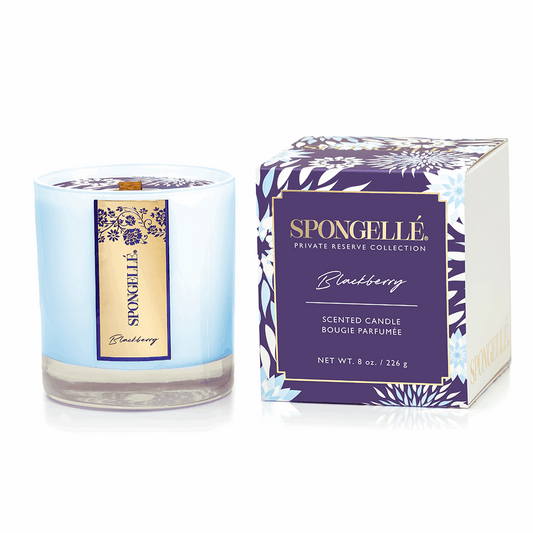 Spongellé Private Reserve blackberry scented candle in a blue glass jar with a purple and gold box.