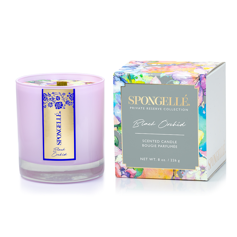 Black Orchid scented candle in a lavender glass container with a floral design box, part of the Private Reserve Collection.