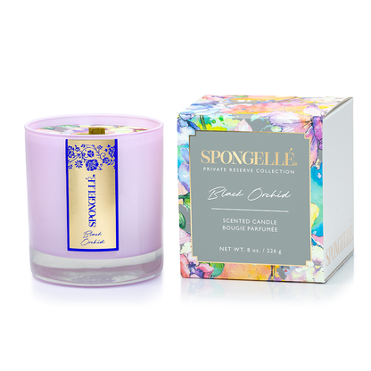 Black Orchid scented candle in a lavender glass container with a floral design box, part of the Private Reserve Collection.