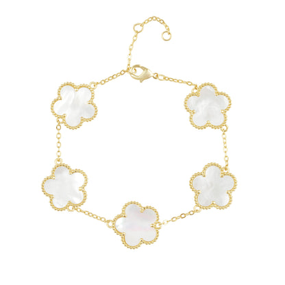 A gold chain bracelet featuring five alternating white mother-of-pearl clover-shaped links with gold borders, displayed on a clean white background.