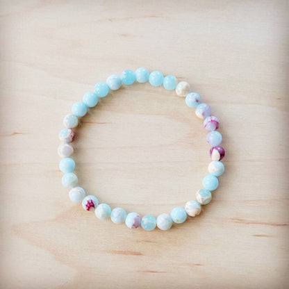 Beaded bracelet with multicolored beads on a wooden surface