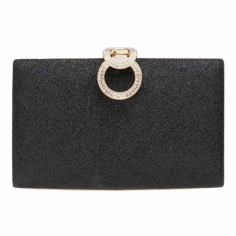 Black clutch bag with a decorative ring on a white background