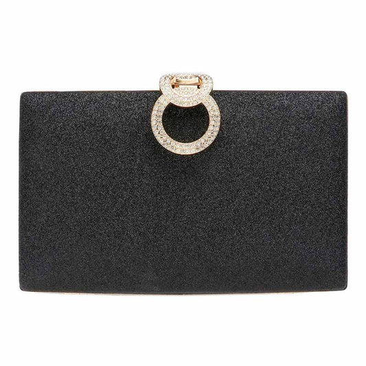 Black clutch bag with a decorative ring on a white background