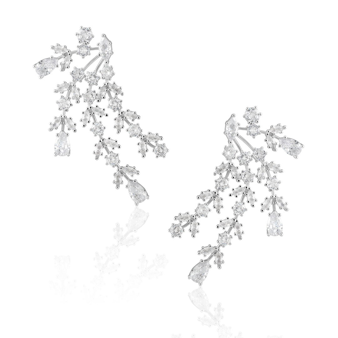 Florence silver statement earrings with branching clusters of clear stones and pear-shaped drops on a white background.