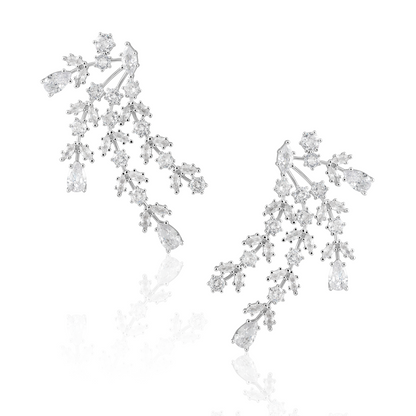 Florence silver statement earrings with branching clusters of clear stones and pear-shaped drops on a white background.