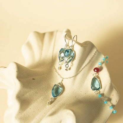 Jewelry set with blue heart-shaped stones on a starfish