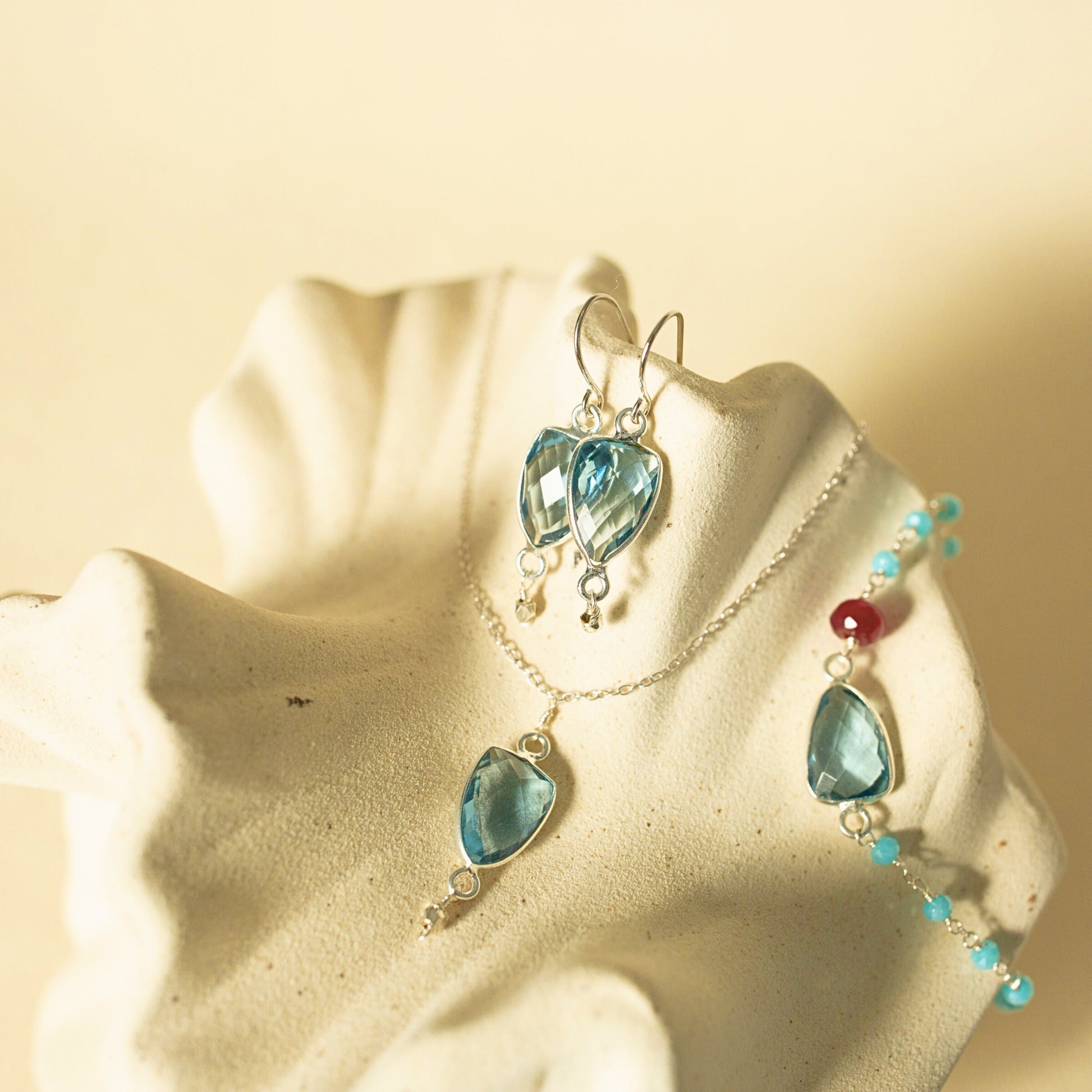 Jewelry set with blue heart-shaped stones on a starfish