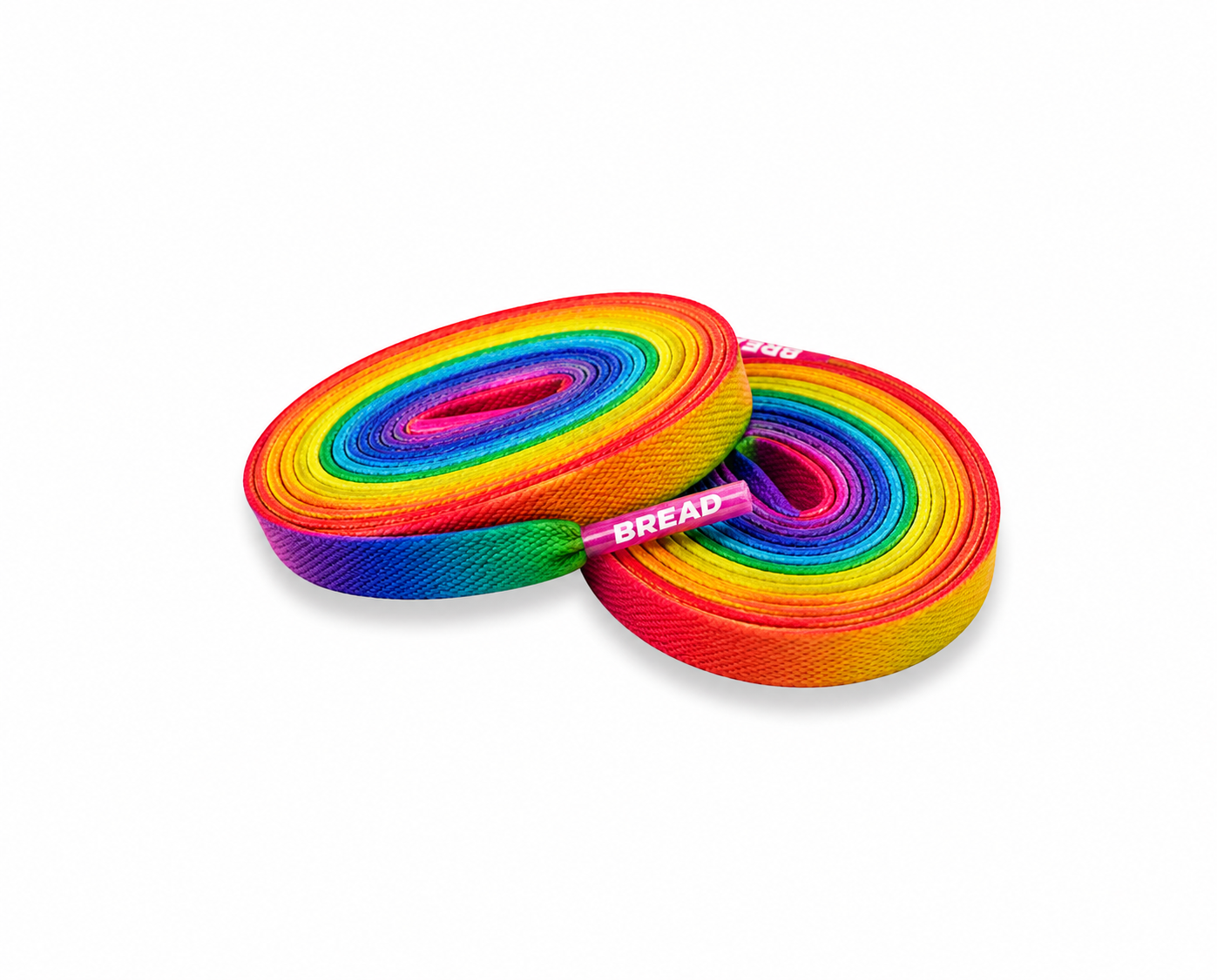 Two rolled rainbow fabric shoelaces with pink tips featuring the white BREAD brand logo.