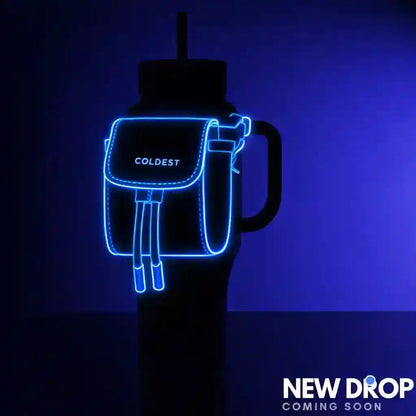 COLDEST water bottle with a mint mini backpack and squeeze holder, featuring a key hanger against a dark background.