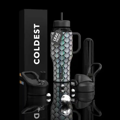 Leak-proof water bottle with patterned design, black box labeled 'COLDEST', and additional accessories on a reflective surface.