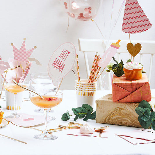 Tablespace featuring pink and gold paper drinking straws for parties.