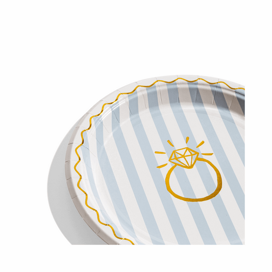 Round paper plate with light blue and white stripes, a gold wavy border, and a gold diamond ring illustration.