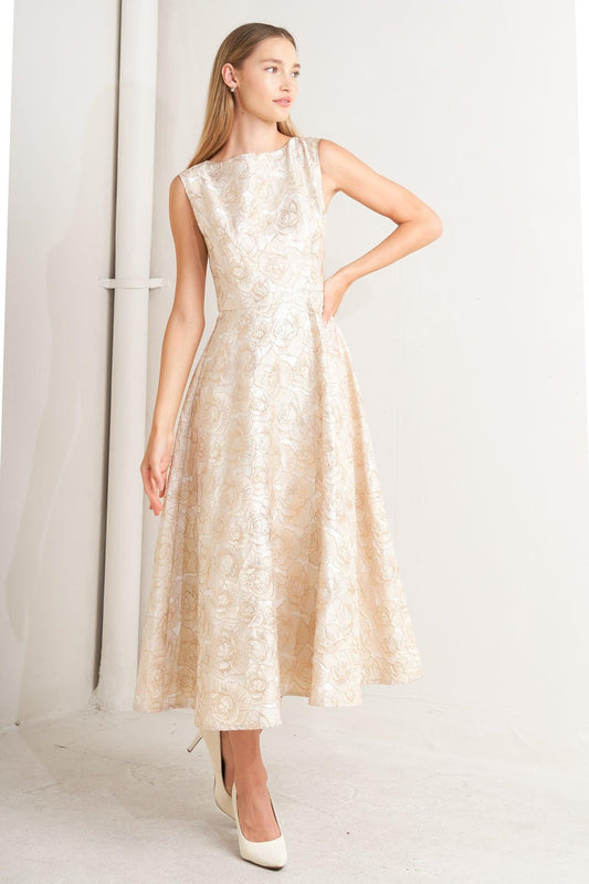 Woman wearing a beige floral dress against a white background