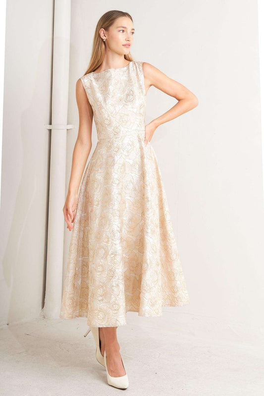 Woman wearing a beige floral dress against a white background