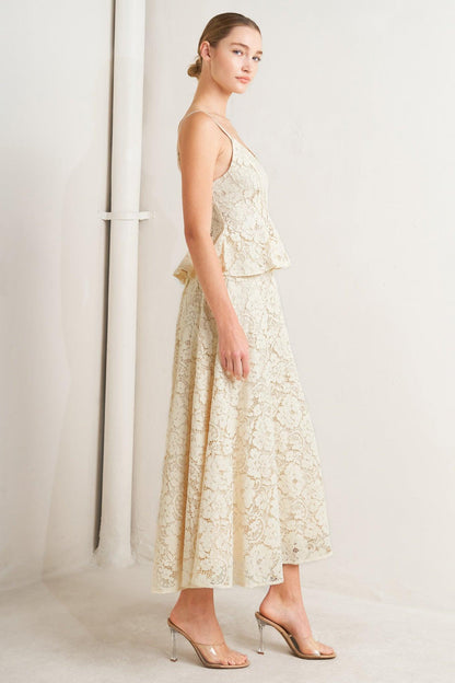 Woman wearing a floral dress against a white background