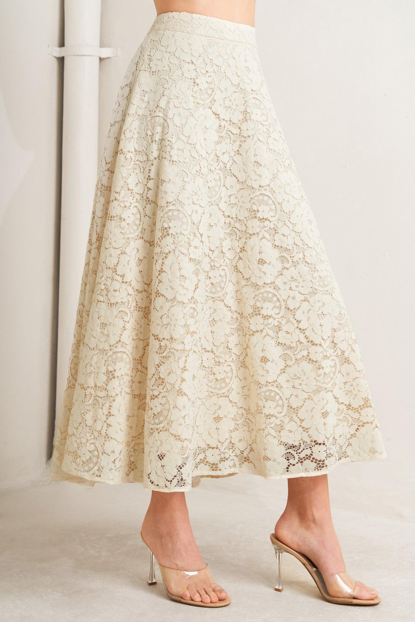 Lace skirt worn by a person on a plain background