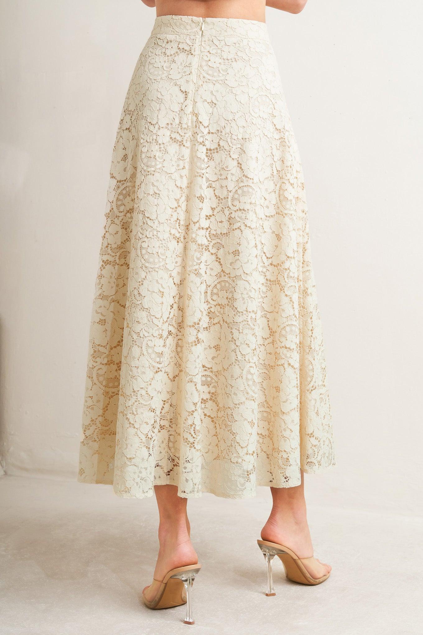 Lace skirt worn by a person on a plain background