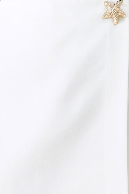 Starfish earring on a white background