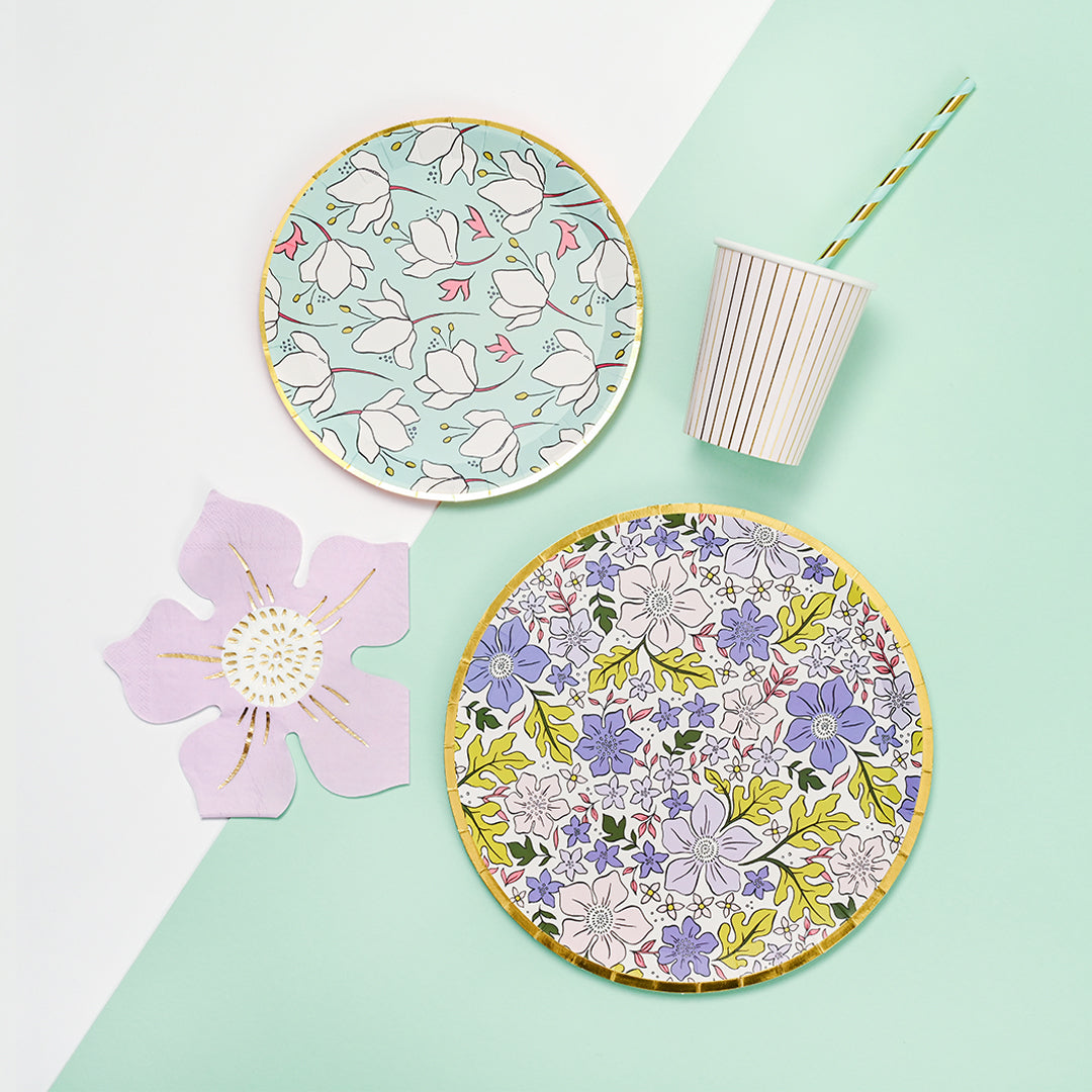 Table setting featuring colorful floral disposable paper plates.