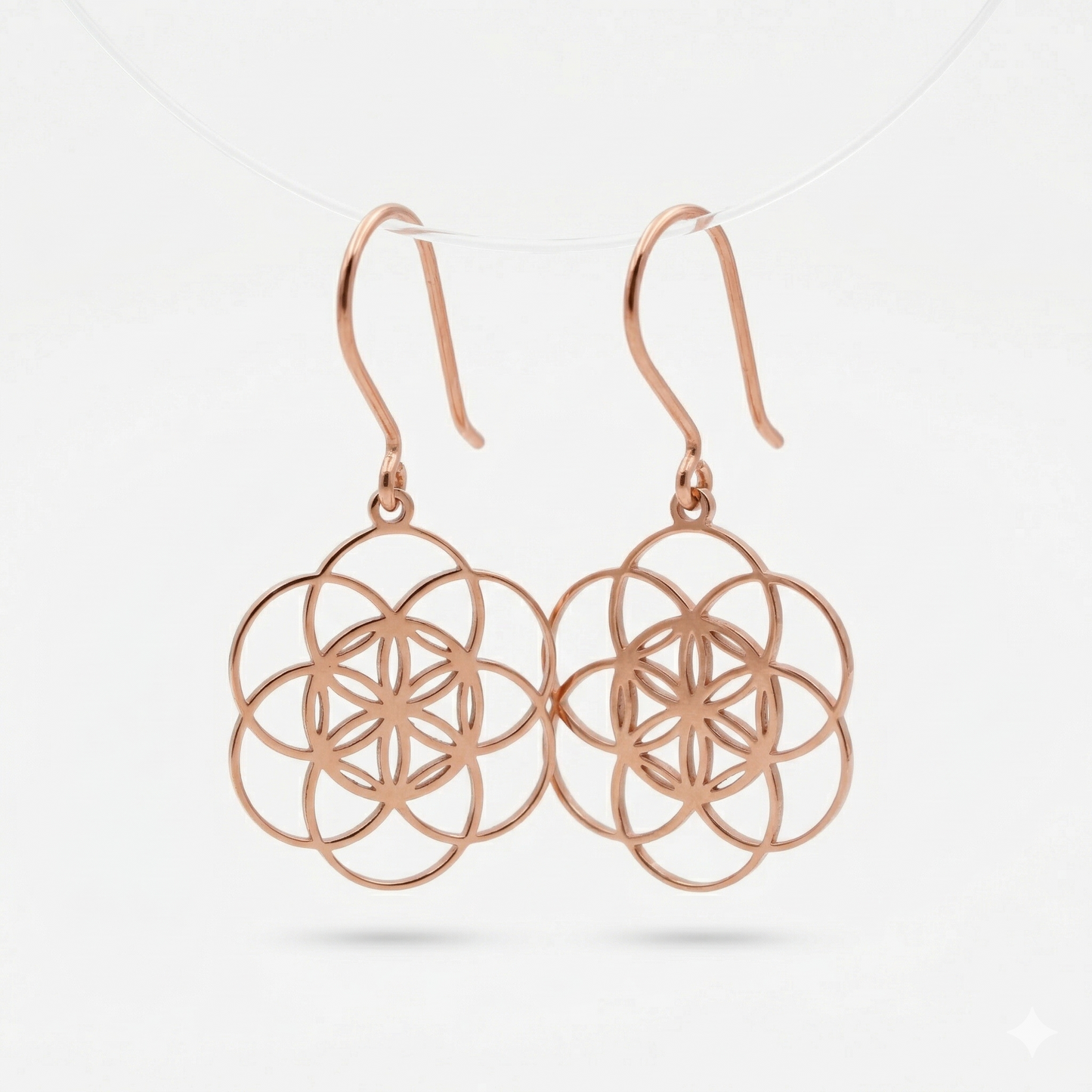 Dangle sacred geometry earrings in 925 sterling silver with intricate floral design and hook clasps.