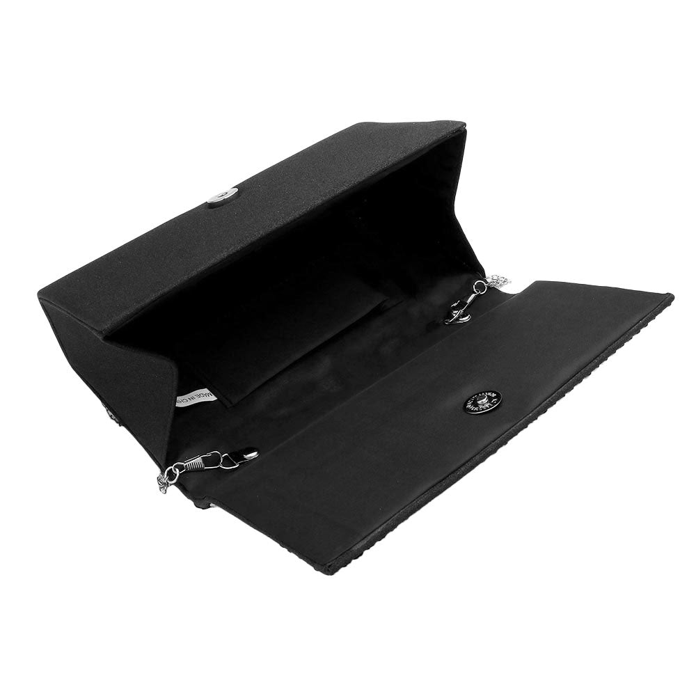 Black clutch bag with a chain strap on a white background