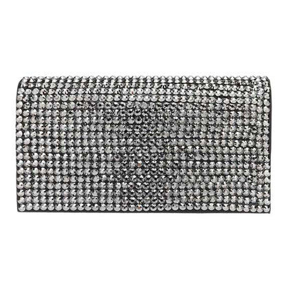 Silver clutch bag with rhinestone embellishments on a white background
